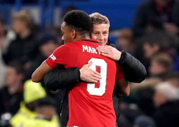Manchester United manager Ole Gunnar Solskjaer (right) hugs Anthony Martial at the end of the Carabao Cup victory against Chelsea