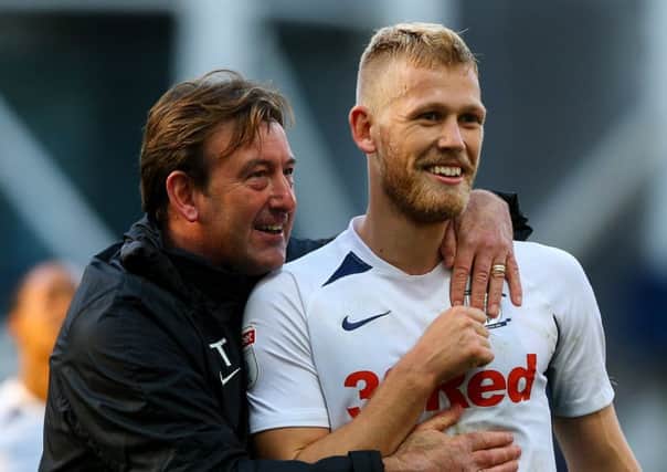 Jayden Stockley with PNE coach Steve Thompson after the victory over Blackburn at Deepdale