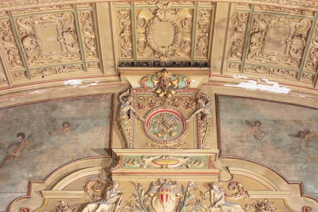 Theatre ceiling detail with painted canvas featuring angels above stage. Photo by Alun Bull Photographer for Historic England