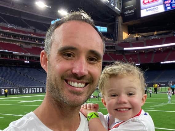 Two-year-old Jaxon Callon, pictured with his dad Ben, of Hoghton, has completed a 1km run in America in support of St Catherines Hospice