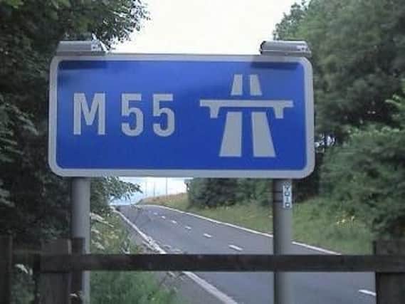 The car was pulled over on the M55