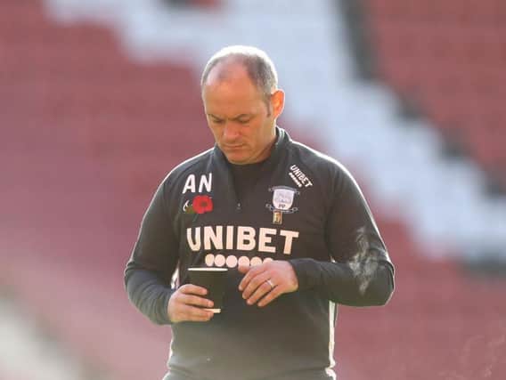 Alex Neil enjoys a pre-match brew at The Valley before Preston's game against Charlton