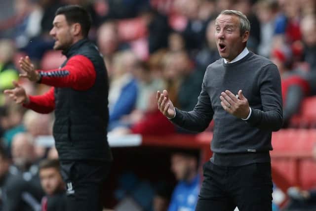 Lee Bowyer (right) gives out instructions during his side's 1-0 loss to Preston North End at the Valley.