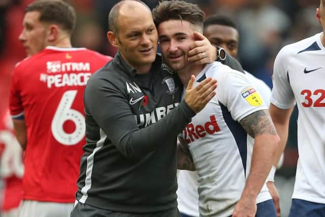 Preston manager Alex Neil gives Sean Maguire a hug after the win at Charlton