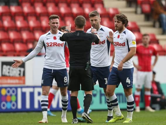 Preston trio Ben Pearson (right), Alan Browne and Paul Gallagher have words with referee David Webb at Charlton