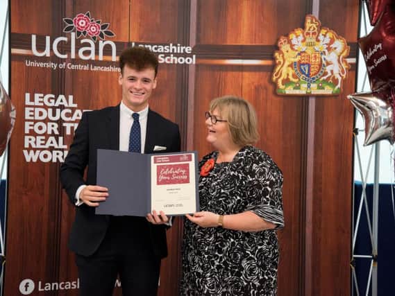 Jonathan receives his Deans List award earlier this year from UCLans Head of Lancashire Law School Vivienne Ivins.
