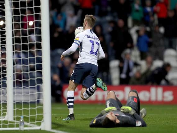 Paul Gallagher celebrates scoring Preston's third goal from the penalty spot