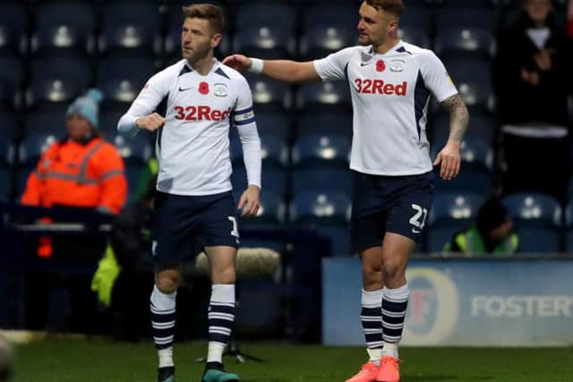 Preston skipper Paul Gallagher is congrartulated by Patrick Bauer after scoring the third goal from the penalty spot