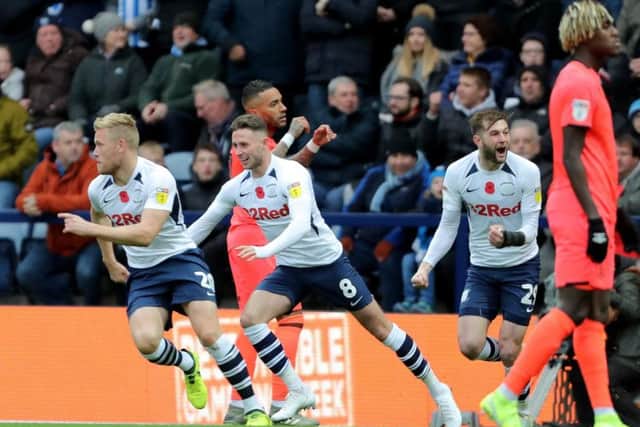 Jayden Stockley turns to celebrate after giving Preston the lead against Huddersfield at Deepdale