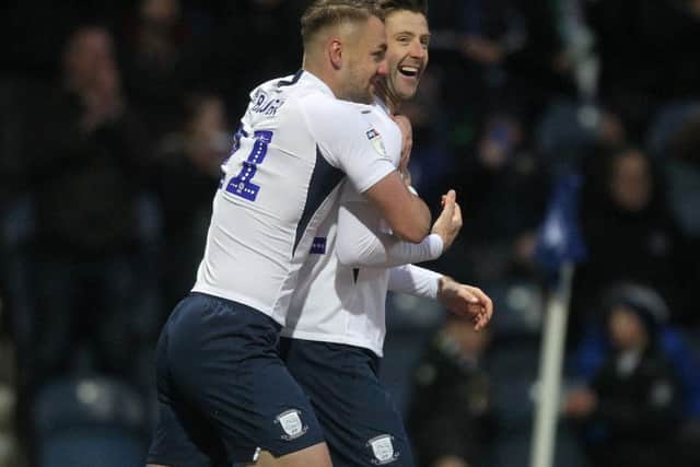 Paul Gallagher and Patrick Bauer celebrate Preston's third goal against Huddersfield at Deepdale