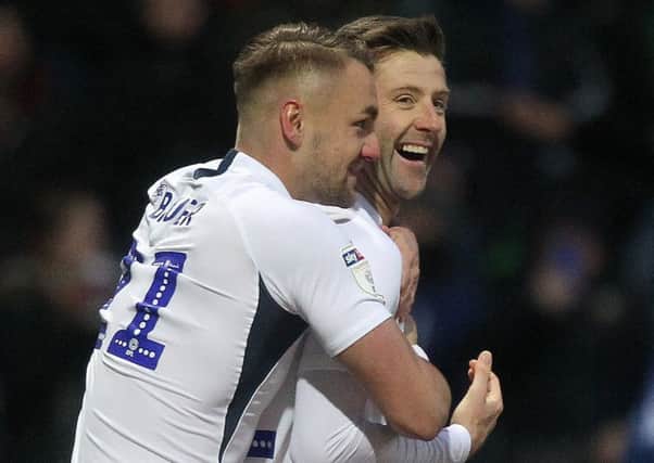 Patrick Bauer and Paul Gallagher celebrate Preston's third goal in the win against Huddersfield