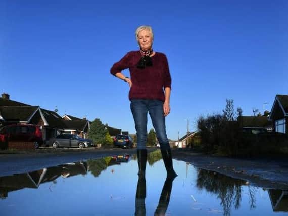 Kate Walker, 69, said her garden turns into a 'swamp' every time it rains due to blocked drains in her Hutton street