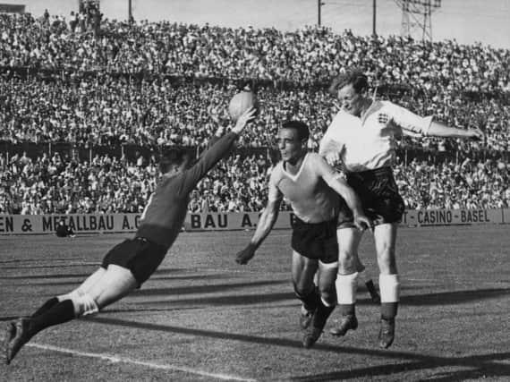 Sir Tom Finney in action for England against Uruguay in the 1954 World Cup in Switzerland - one of 76 appearances for his country