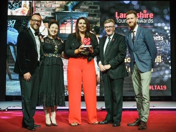 Professional ice-skater Daniel Whiston (left) presenting an award to Golden Ball of Longton's Emma Golpys, Victoria Duffy and pub owner Chris Buckley (far right). They are pictured with John Gillmore of BBC Radio Lancashire (second right).