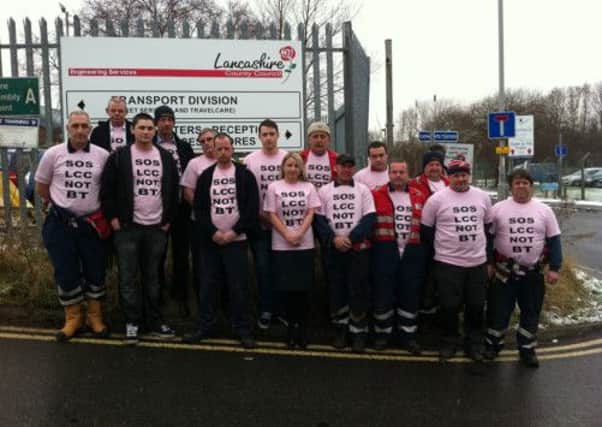 Fears: Lancashire County Council fleet services workers express their fears outside the Bamber Bridge depot