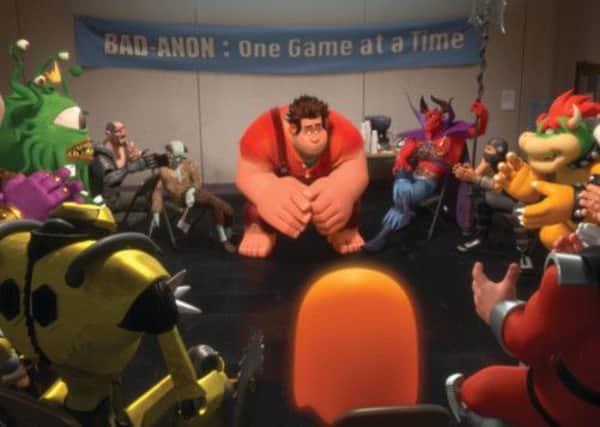 BAD GUYS: Ralph, centre, (voiced by John C. Reilly) amongst other video game bad guys in a scene from Wreck It Ralph. Inset: Ralph in the video game world of Heros Duty
