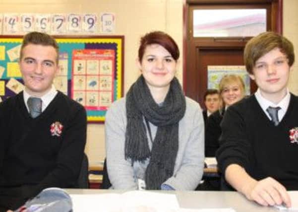 Welcome: Year 11 students Joel Claxton (left) and Nye Morris (right) with Janna Ruiters