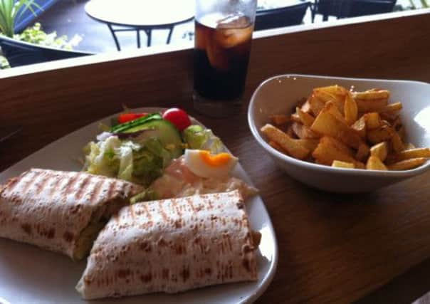 Tasty treat: Lauras lunch of southern fried chicken goujon wrap, salad and chips at Orchid Coffee Bar