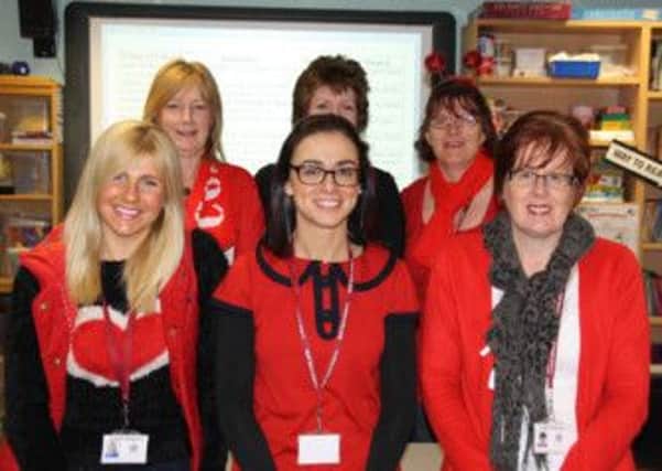 Ladies in red: From left, back Hazel Critchley, Debbie Rhodes, Alison Daniel, front Sarah Smith, Michelle McGrath and Sandra Fagan