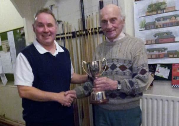 Well done: Dave McKay, left presents the Maureen McKay Memorial Trophy dominoes cup to Frank Whittaker at Whittingham Club