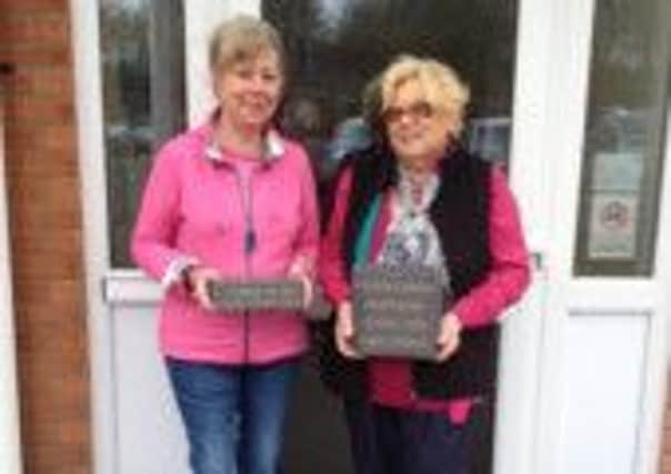 Christine Fleet (left) and Christine Cameron (right) with their bricks outside St Michaels school