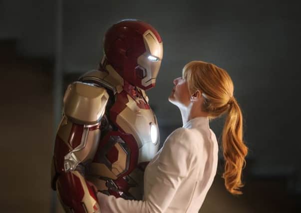 Robert Downey JR. as Iron Man with Gwyneth 
Paltrow as Pepper Potts