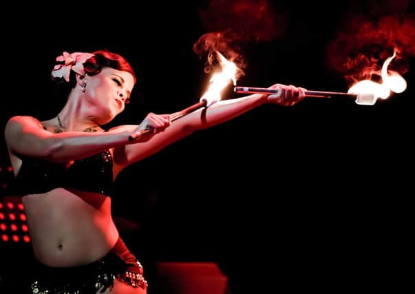 What a scorcher: Fire eating burlesque girl, Angie Sylvia, one of the Folly Mixtures troupe