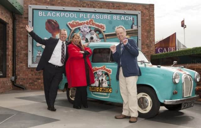 Deputy MD Nick Thompson, MD Amanda Thompson and Aardman creator Nick Park outside the A35 van at Thrill-O-Matic ride