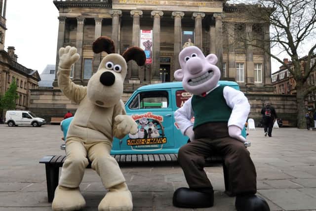 Cracking ride: Wallace and Gromit on the Flag Market with their van