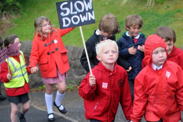 Whittle-le-Woods Primary School students take part in Brake's annual giant walking bus to raise awareness of road safety