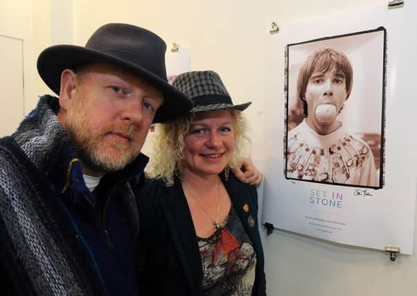 Renowned photographer Ian Tilton and partner Claire Caldwell, who co-wrote the Set In Stone book about the Stone Roses, and his famous photo of Roses singer Ian Brown.