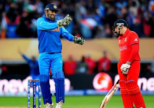 Thrilling: India skipper MD Dhoni celebrates after James Tredwell fails to hit the final ball for six
