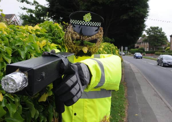 Live feed: The scarecrow traffic cop and speedgun