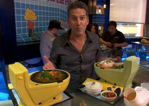 Bob Blumer eating a toilet curry in Taiwan