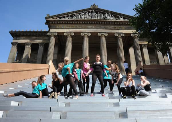 Statuesque: Preston Youth Dance Company, re-enacting the famous sculpture above,on the Flight at the Harris Museum and Art Gallery
