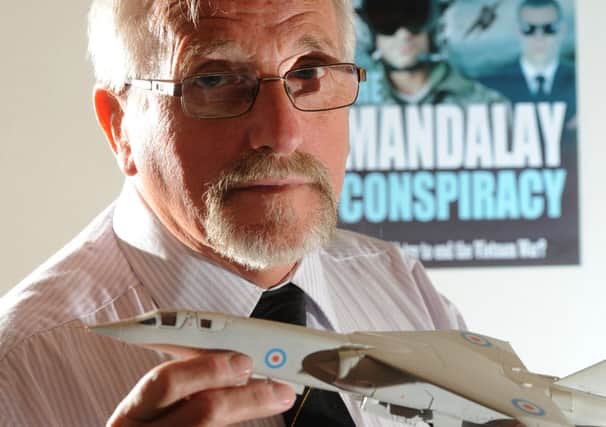 Taking flight: Author, Lloyd Martin, pictured here with a model TSR 2 aircraft, has released a book based around activities at BAE Systems during the 60s