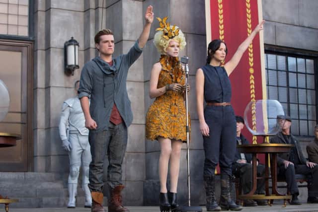 Elizabeth Banks, Josh Hutcherson and Jennifer Lawrence in The Hunger Games: Catching Fire.