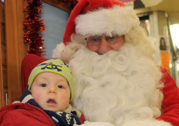 Oliver Newsham, seven months with Santa at his Grotto in Preston Indoor Market