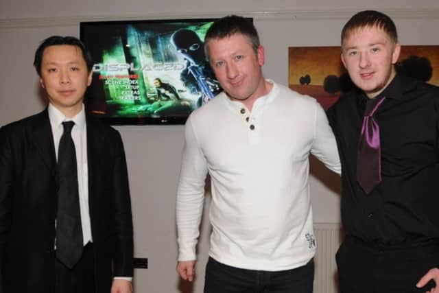 Martial arts and action film star Mark Strange, from Leyland, screened his first film Displaced in the Leyland 
Railway Public House. He is pictured with his longtime collaborator, director Chee-Keong Cheung, left and his son
