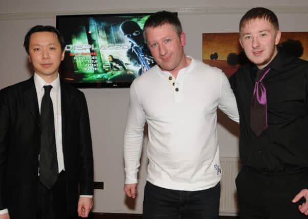 Martial arts and action film star Mark Strange, from Leyland, screened his first film Displaced in the Leyland 
Railway Public House. He is pictured with his longtime collaborator, director Chee-Keong Cheung, left and his son