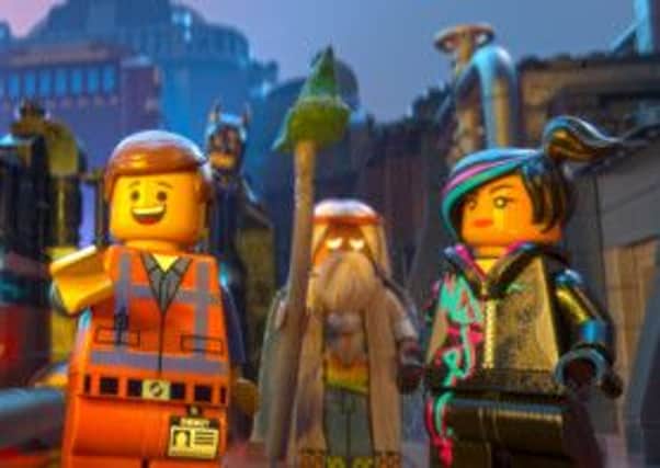 The LEGO Movie: Emmet (Chris Pratt), Batman (Will Arnett), Vitruvius (Morgan Freeman) and Wyldstyle (Elizabeth Banks)