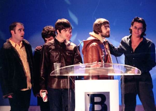 February 1996: Oasis accepting an award during the Brit Awards where frontman Liam Gallagher (centre right) berated INXS singer Michael Hutchence (right) saying has-beens shouldn't be giving awards to gonna-bes  making last nights show a byword for the perils of live television