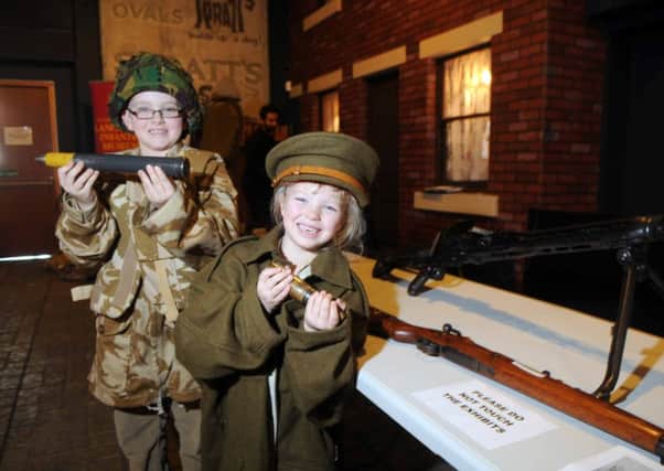 Ben and Amy Bland from Leyland with some of the weapons used by Muslim soldiers at the Museum of Lancashire. The history of Indian soldiers during the First and Second World Wars was told by university lecturer Jahan Mahmood on Wednesday. Today the Stanley Street institution will be switching its focus to the Land Army girls
