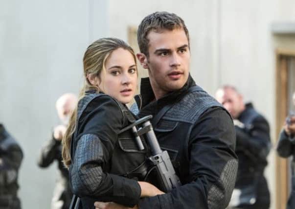 Divergent: SHAILENE WOODLEY as Tris and THEO JAMES as Four