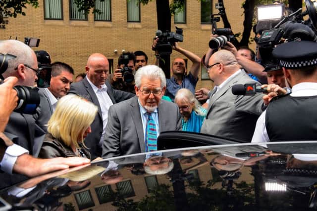 Rolf Harris leaves Southwark Crown Court after being found guilty of 12 sex charges involving four women.