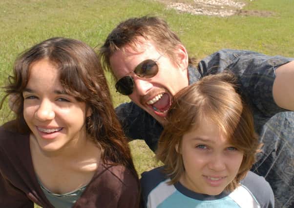 Boyhood: Lorelei Linklater as Samantha, Ethan Hawke as Dad and Ellar Coltrane as Mason.