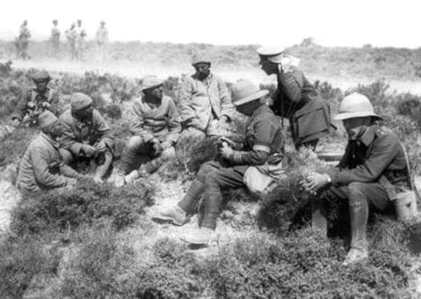 Members of the Lancashire Fusiliers interrogate Turkish Army at Cape Helles in Gallipoli.