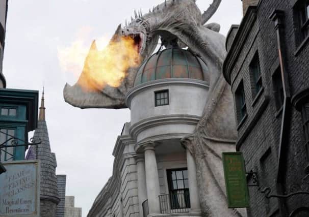 Ukrainian Ironbelly dragon breathing fire from the top of Gringotts Bank, The Wizarding World of Harry Potter - Diagon Alley