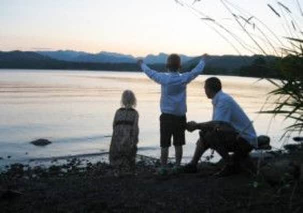 Beauty: Families can enjoy the stunning scenery  from the lake shore opposite the hotel grounds at sunset