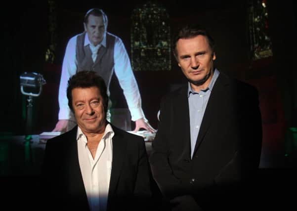 War of The Worlds musical creator Jeff Wayne (left) and  Liam Neeson,  in front of a holographic image of Neeson